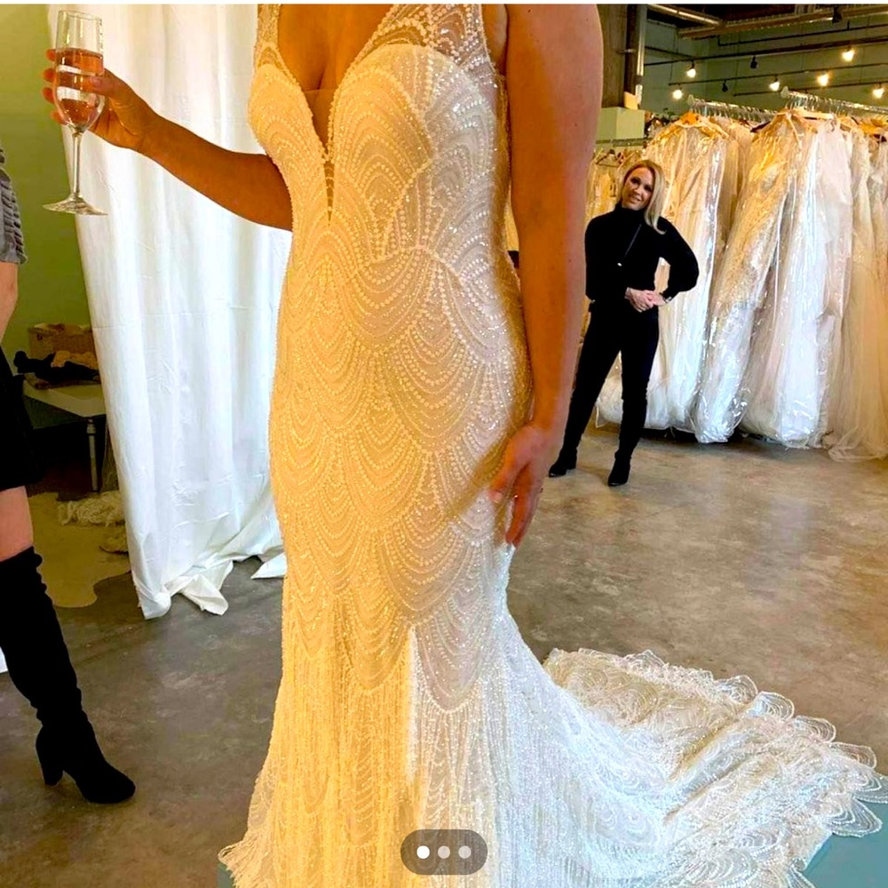 Beautiful designer wedding gown worn once and professionally cleaned.